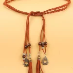 Ceinture en corde tressée à décoration de pompon