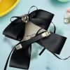 barrette classique en ruban à nœud noir pour femme ; accessoire mignon pour épingle à cheveux et pince à queue de cheval ; bandeau noir parfait pour les filles.