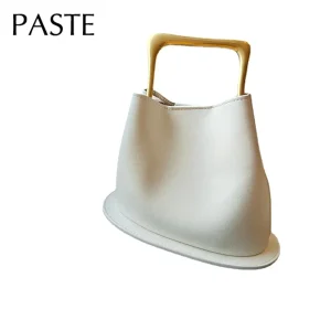 Nouveau élégant haut de gamme seau fourre-tout couleur Beige plaine Satin cuir de vache femmes sac à main poignée en métal femme sac à bandoulière petit