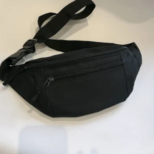 Sac banane de sport – Grand sac à bandoulière pour course à pied, voyage et entraînement – Sac de taille mains libres pour téléphone et portefeuille
