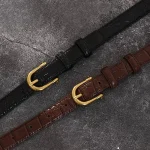 Ceinture en cuir véritable rétro pour femme, ceinture fine pour femme, ceinture en jean pour femme, structure en métal doré, environnement de luxe, mode de créateur