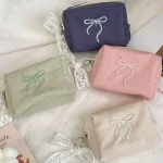 2025 Chic mignon arc trousse de maquillage pour les femmes Portable cosmétique stockage sac à main fermeture éclair trousse de toilette pochette rose