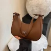 sac à bandoulière simple pour femmes, style coréen avec décoration d'arc, sac à la mode en forme de croissant pour les déplacements décontractés