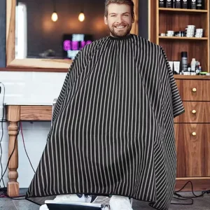 Cape de coiffure élégante à rayures noires avec brosse intégrée pour dépoussiérer le cou, utilisation en Salon à domicile