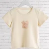 t shirt beige imprimé dessin animé pour femme, haut court, col rond, manches courtes, streetwear, vintage, chic, y2k, été, 2024