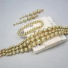 ensemble de bijoux de luxe en perles d'or : collier de déclaration, boucles d'oreilles pendantes et bracelet pour femmes élégantes