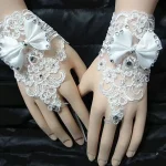 Gants courts en dentelle incrustés de biscuits avec nœud papillon pour patients, élégants, minces, sans doigts, blanc, ivoire, accessoires de robe de mariée