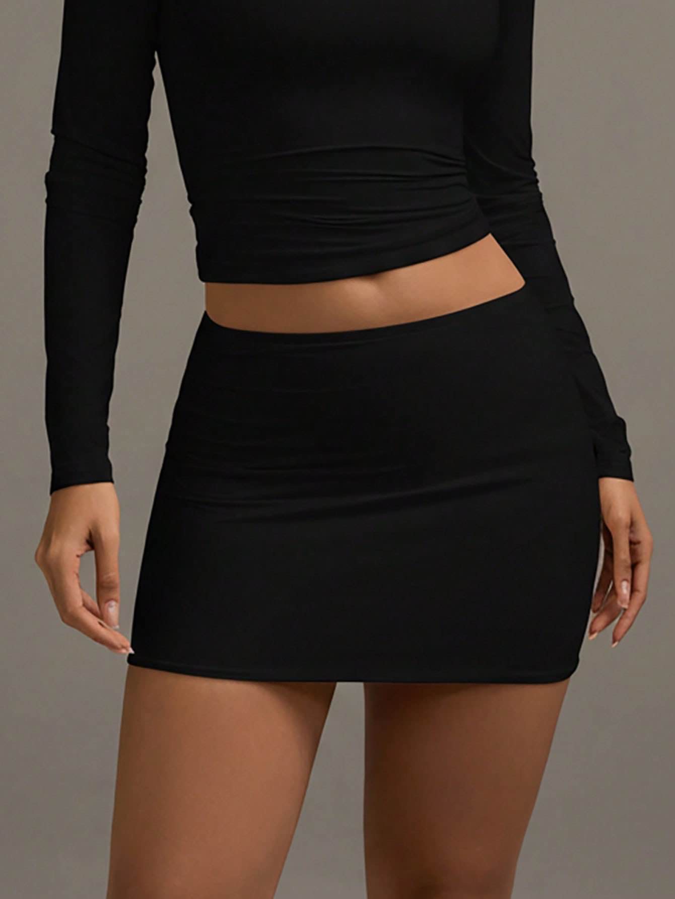 Mini-jupe pour femme, jupe courte élégante noire à taille élastique et moulante