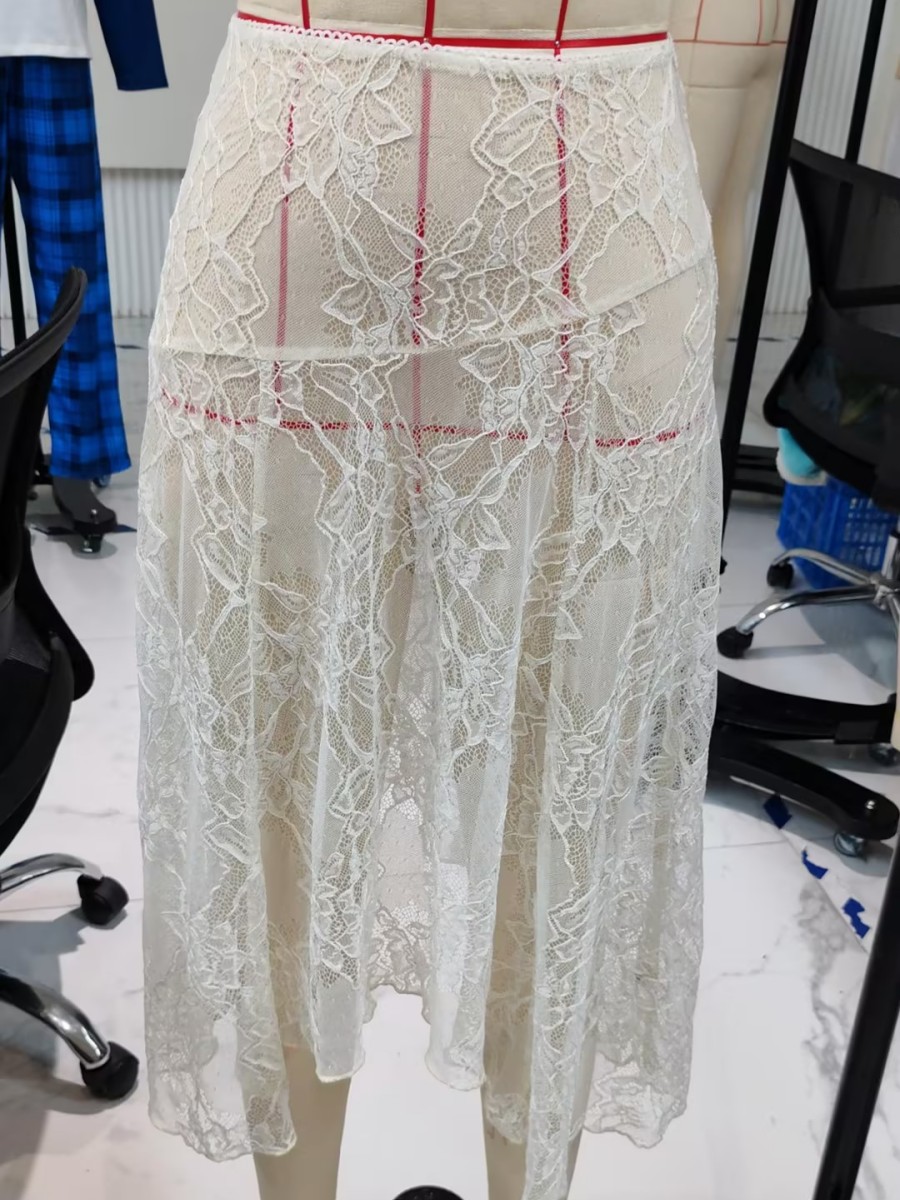Femmes été Sexy pure dentelle jupe fleur couleur unie transparent taille basse jupe Midi jupe décontractée pour fête jupes de plage