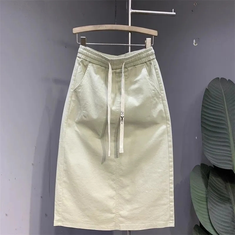 Mode coréenne 2025 nouvelle jupe d'été femmes décontracté sauvage taille haute Simple mi-longue fendue a-ligne jupe mince dames vêtements