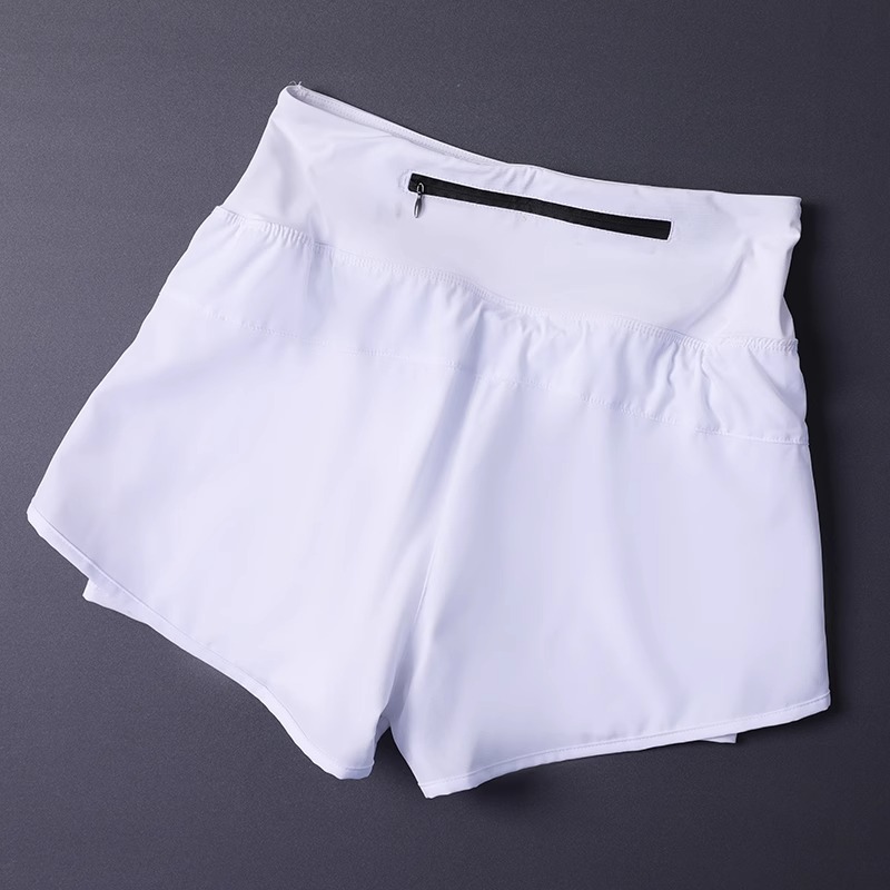Short 2 en 1 pour femme avec poches – Léger, respirant, ample, anti-exposition, côté fendu pour le yoga, la course à pied, la salle de sport