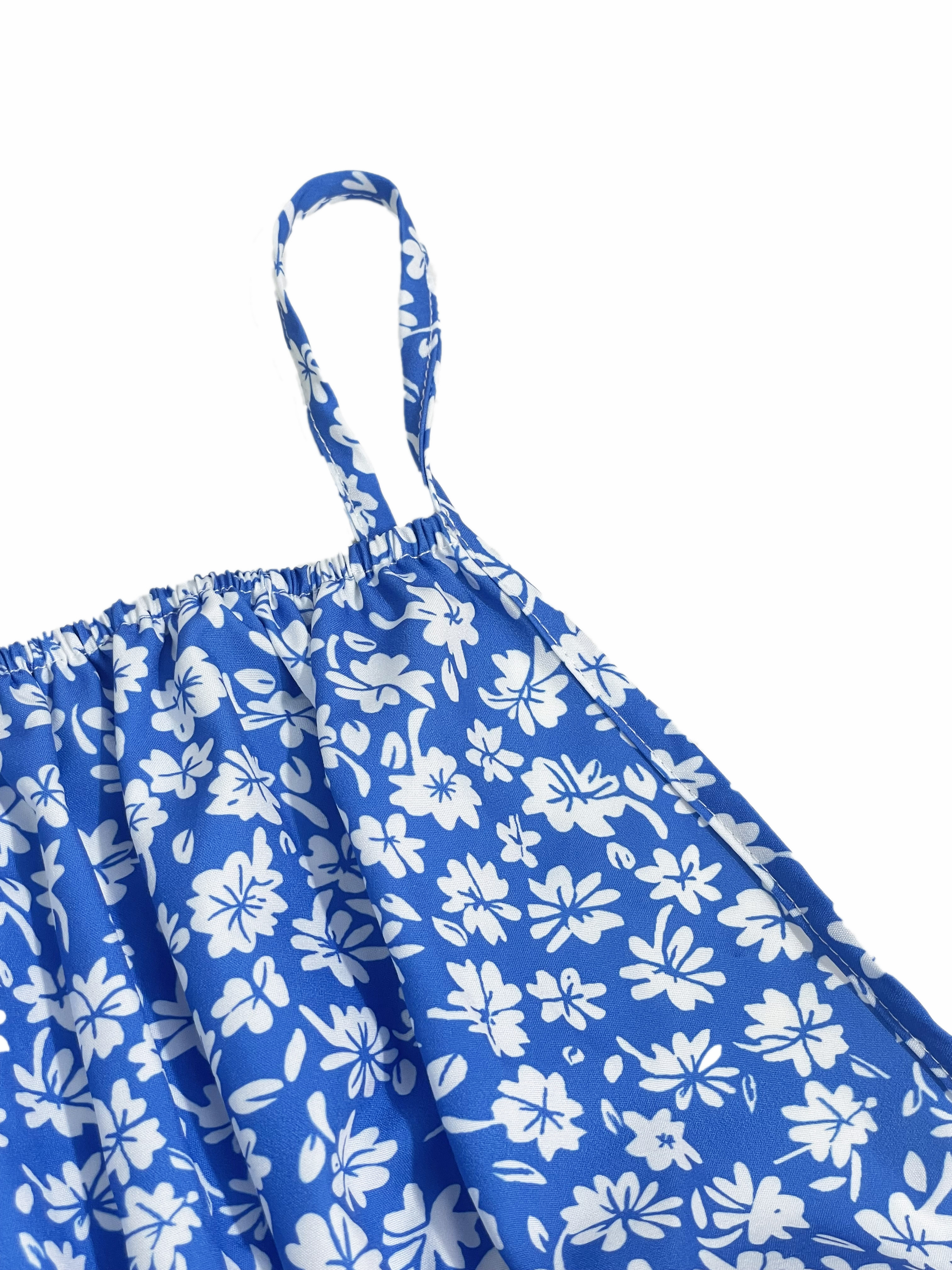 La robe caraco à petites fleurs imprime un design dos nu et des fines bretelles spaghetti convient aux vacances à la plage et à l'été