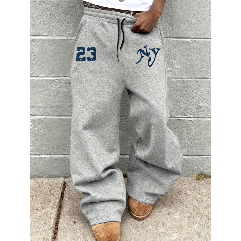 Pantalon de sport pour hommes, avec un motif de lettres unique imprimé, ceinture élastique avec cordon de serrage, très adapté au streetwear