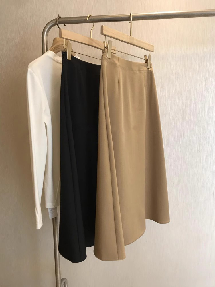 Jupe mi-longue plissée à taille haute de couleur unie décontractée pour femmes printemps-automne