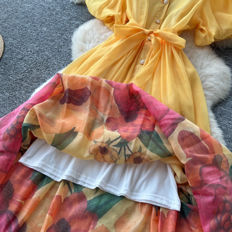 Robe longue maxi bohème à imprimé floral pour femme, collection été 2026, avec manches bouffantes et boutonnage simple, idéale pour les soirées et les vacances