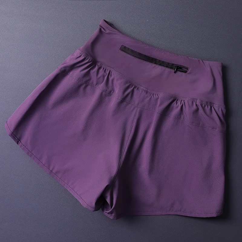 Short 2 en 1 pour femme avec poches – Léger, respirant, ample, anti-exposition, côté fendu pour le yoga, la course à pied, la salle de sport