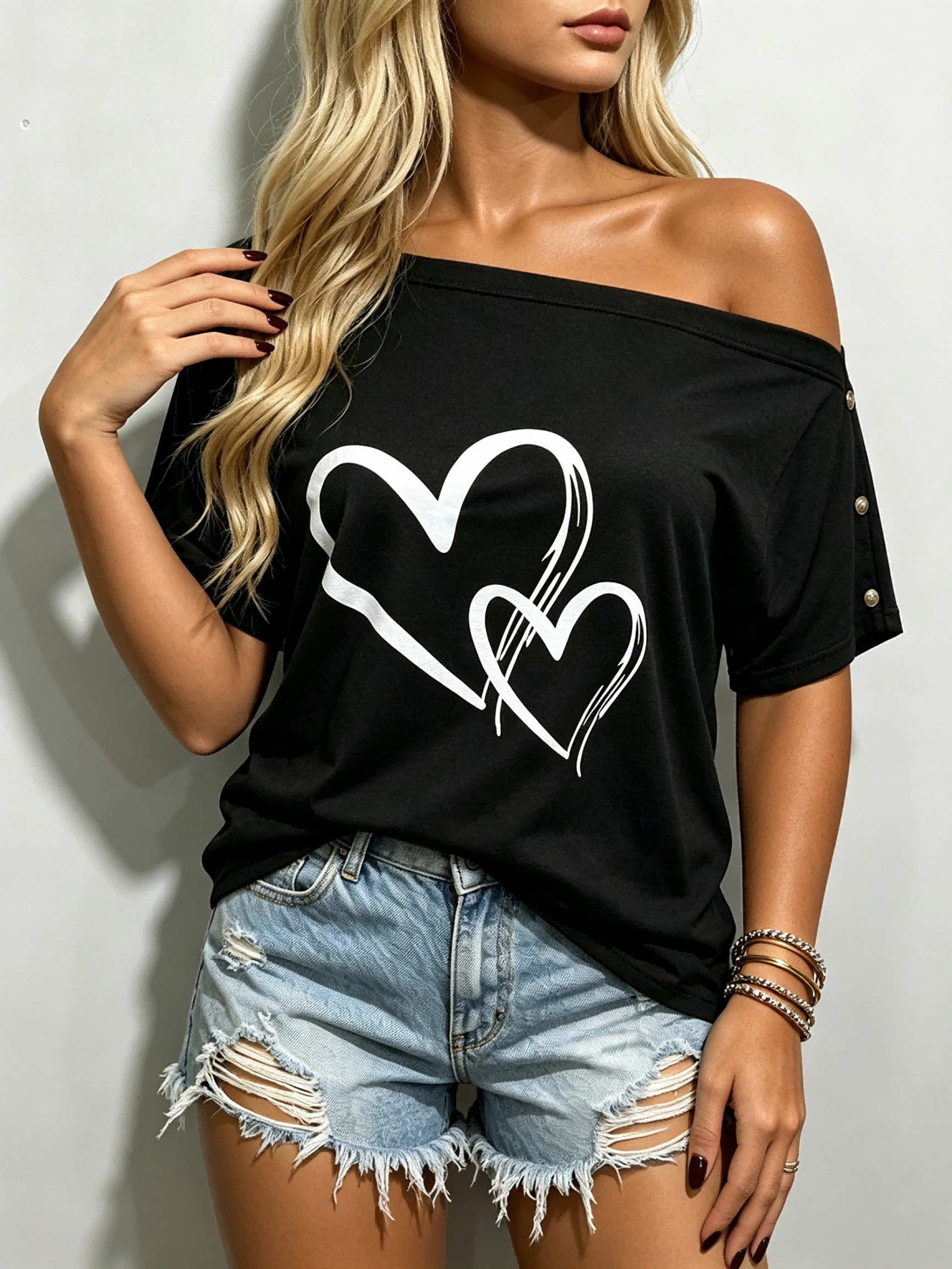 T-shirts d’été pour femmes, motif cœur, coupe ample, idéal pour le quotidien, modèle à épaules dénudées, manches courtes, haut décontracté noir, parfait pour les fêtes et les sorties.