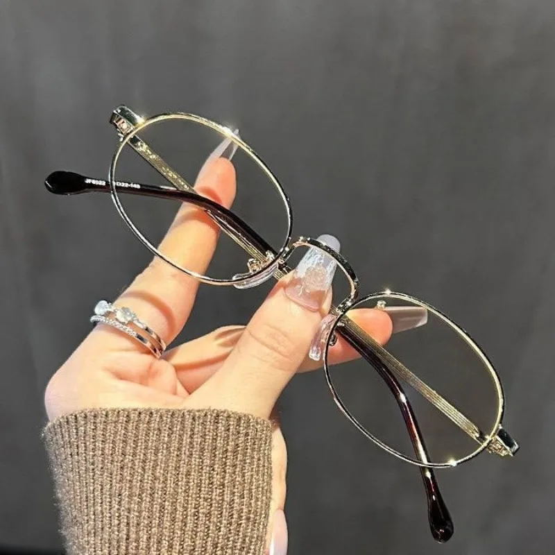 Nouvelle mode montures de lunettes ton or dames élégantes montures métalliques ovales Vintage lunettes confortables ultra-légères
