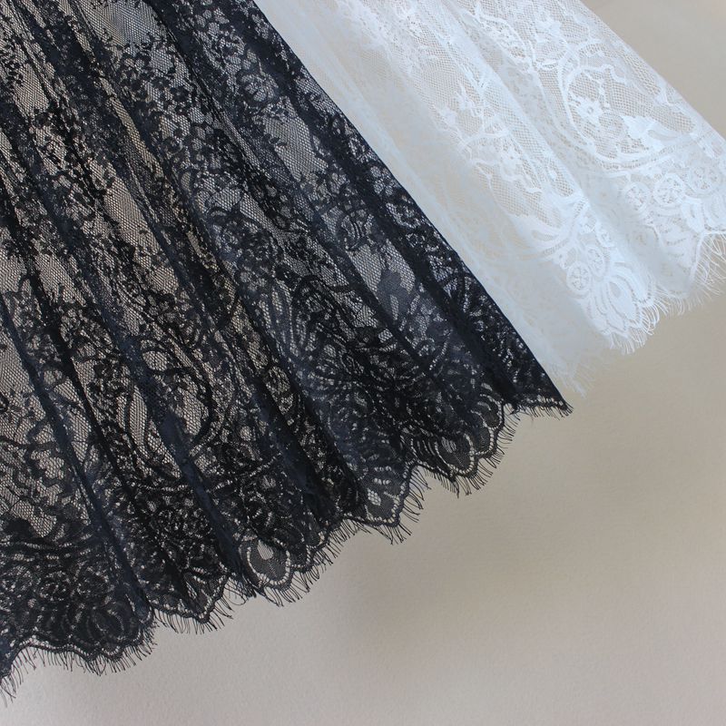 Été chaud femmes dentelle jupes mode solide décontracté maille Tulle jupe évider court crayon élégant élastique noir blanc jupe