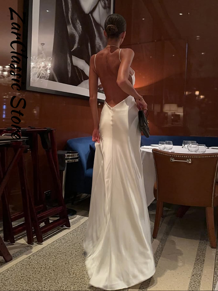 Robe de soirée élégante en satin sans dos pour femme, blanche, col en V, sans manches, avec fente, bretelles, nouvelle collection été 2026