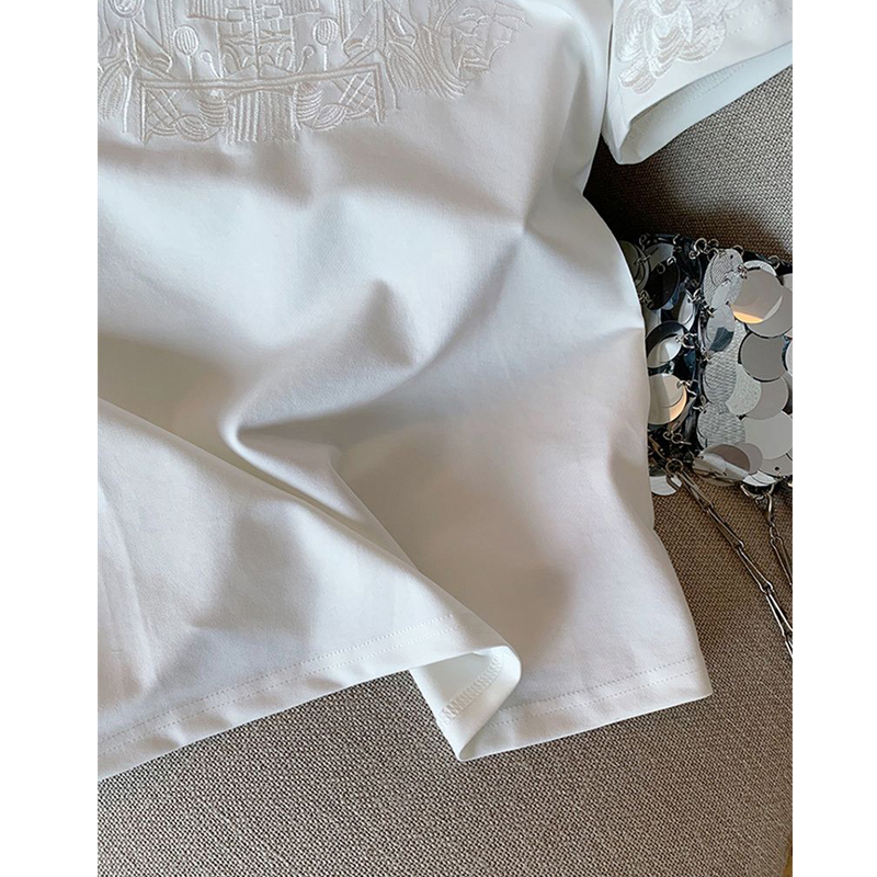 Femmes vêtements été mode Vintage broderie blanc coton basique t-shirt femme Simple décontracté col rond manches courtes hauts amples