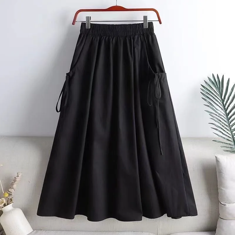 Jupe mi-longue élastique taille haute, style workwear, tendance été 2025, polyvalente, amincissante, avec ceinture et cordon de serrage, poches, longueur midi