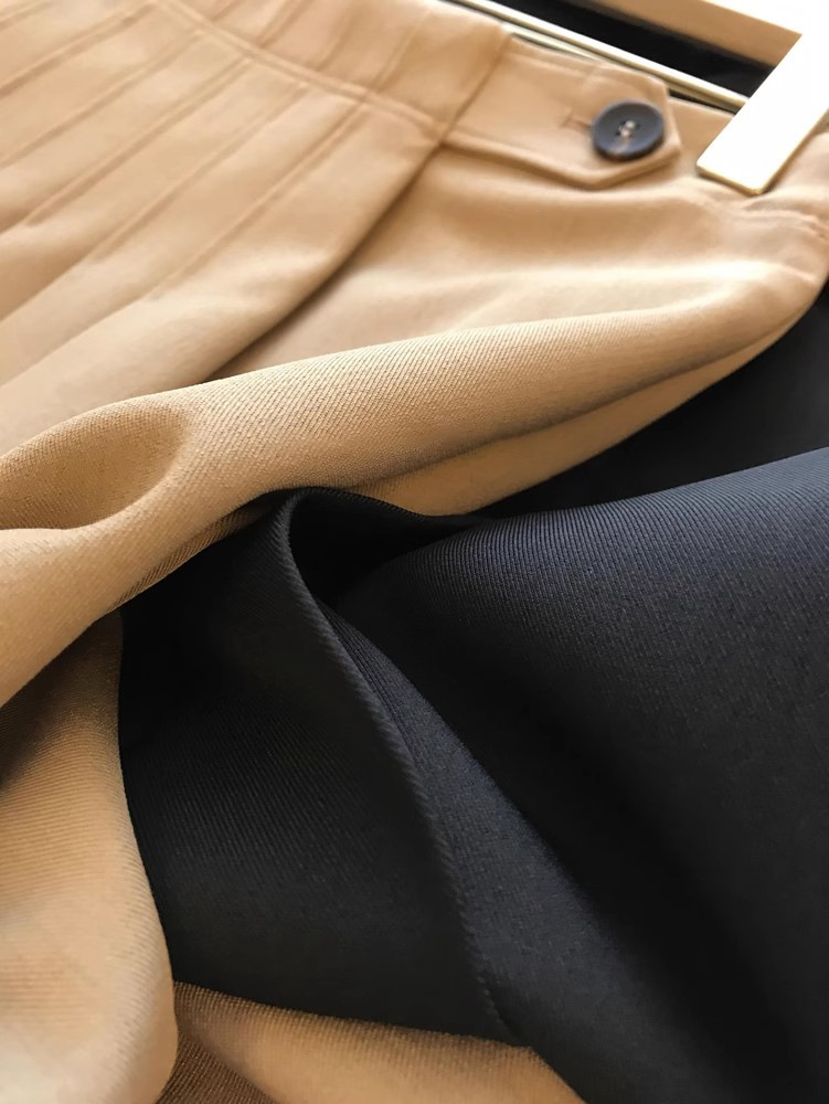 Jupe mi-longue plissée à taille haute de couleur unie décontractée pour femmes printemps-automne