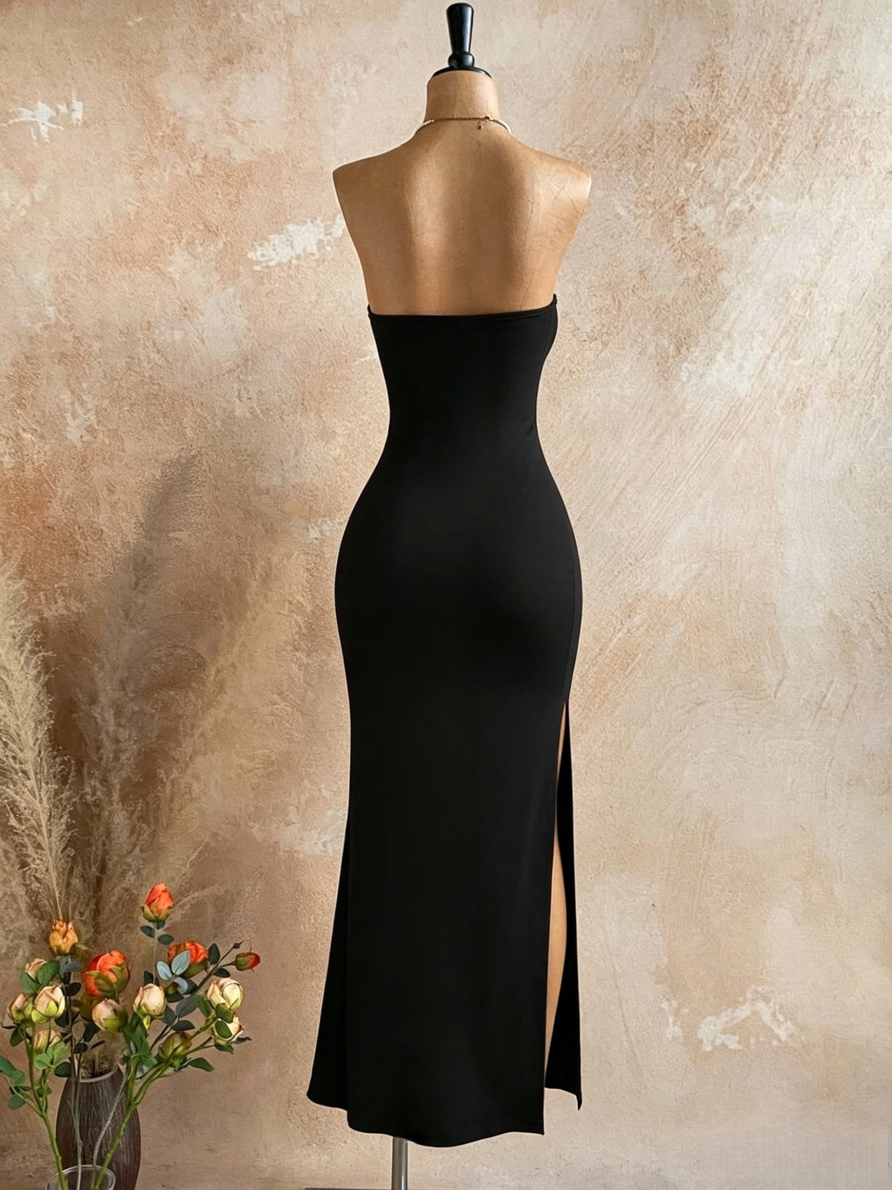 Robe longue de soirée moulante noire unie sans bretelles avec fente latérale haute pour femme
