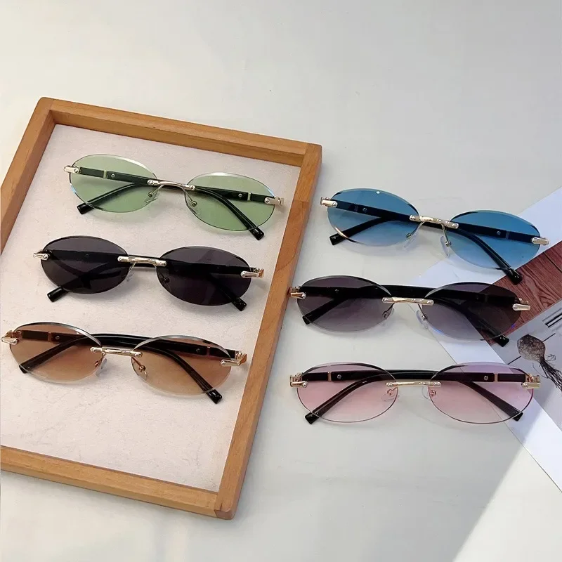 Lunettes de soleil en métal haut de gamme pour femmes et hommes, monture ovale personnalisée, rétro, luxueux, sans cadre, pour voyage, UV400
