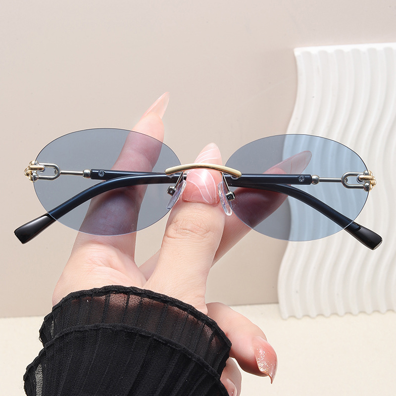 Lunettes de soleil œil de chat rondes sans monture pour femmes, monture circulaire en alliage, élégantes, décontractées, pour le voyage