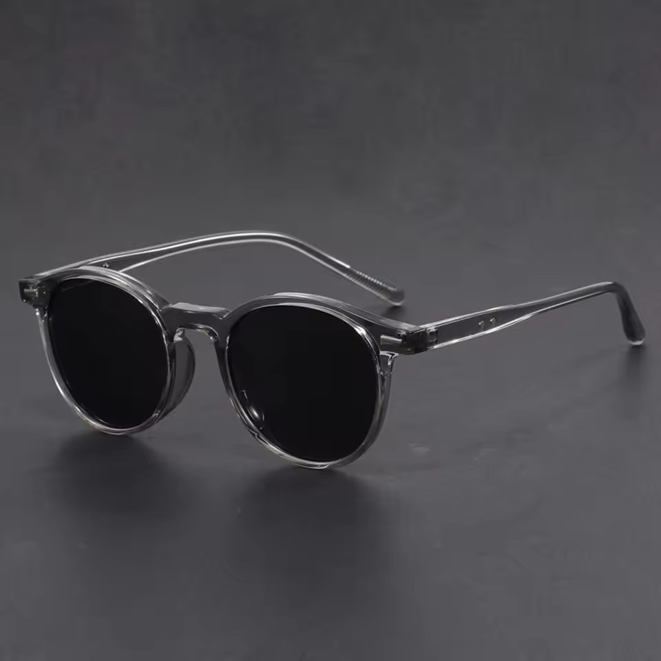Lunettes de soleil rondes classiques pour hommes et femmes – Monture noire avec accent argenté, verres polarisés UV400, lunettes de soleil de style rétro vintage