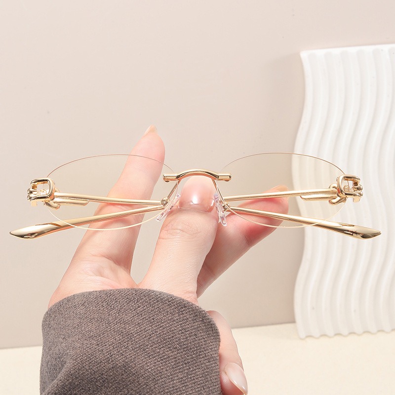 Lunettes de soleil ovales élégantes pour femmes, sans monture, décontractées, avec monture métallique, verres anti-lumière bleue, protection UV400, style urbain avancé