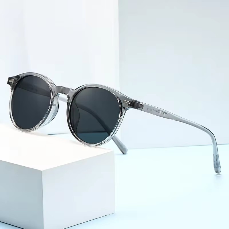 Lunettes de soleil rondes classiques pour hommes et femmes – Monture noire avec accent argenté, verres polarisés UV400, lunettes de soleil de style rétro vintage