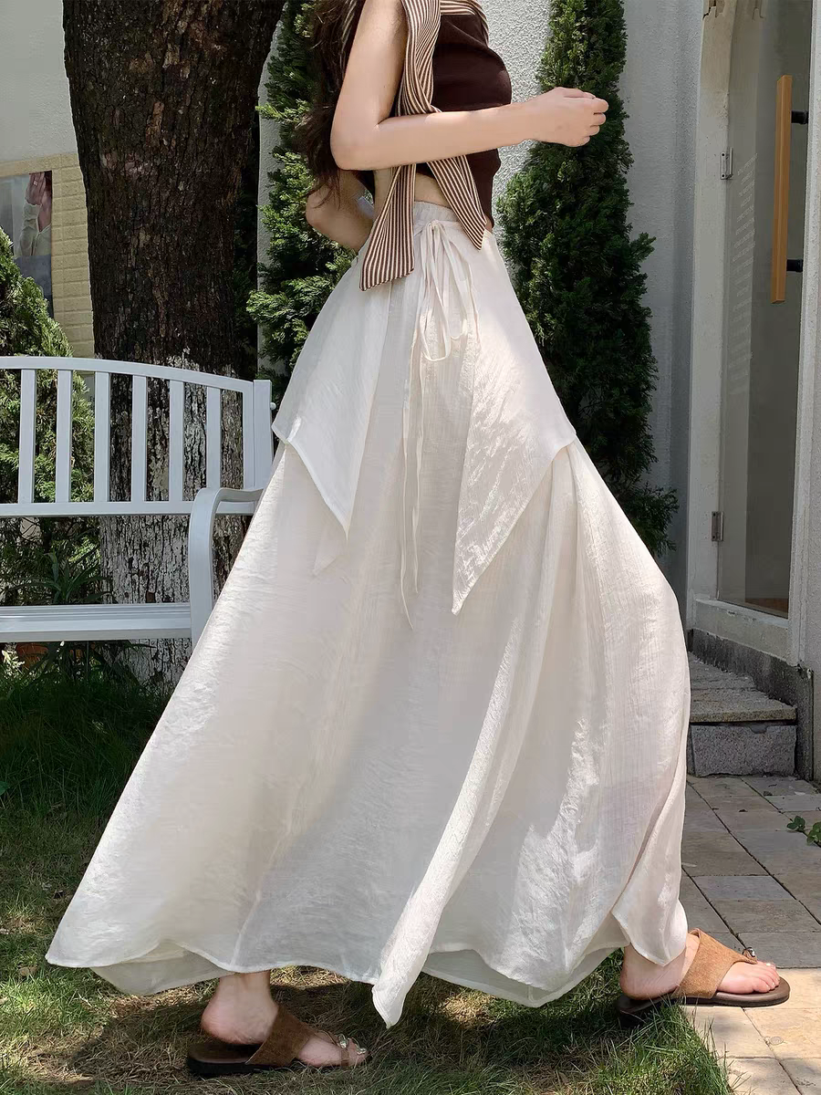 Nouvelle jupe longue évasée taille haute à nouer pour femme, style bohème fluide, collection été 2026, idéale pour couvrir les hanches