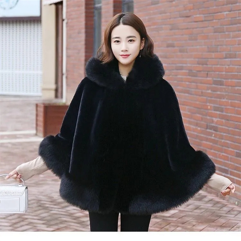 Manteau en fourrure noire pour femmes, nouveau modèle d'hiver, style cape courte, imitation fourrure de renard, coupe-vent épais à capuche, manteau chaud en fausse fourrure pour femme.