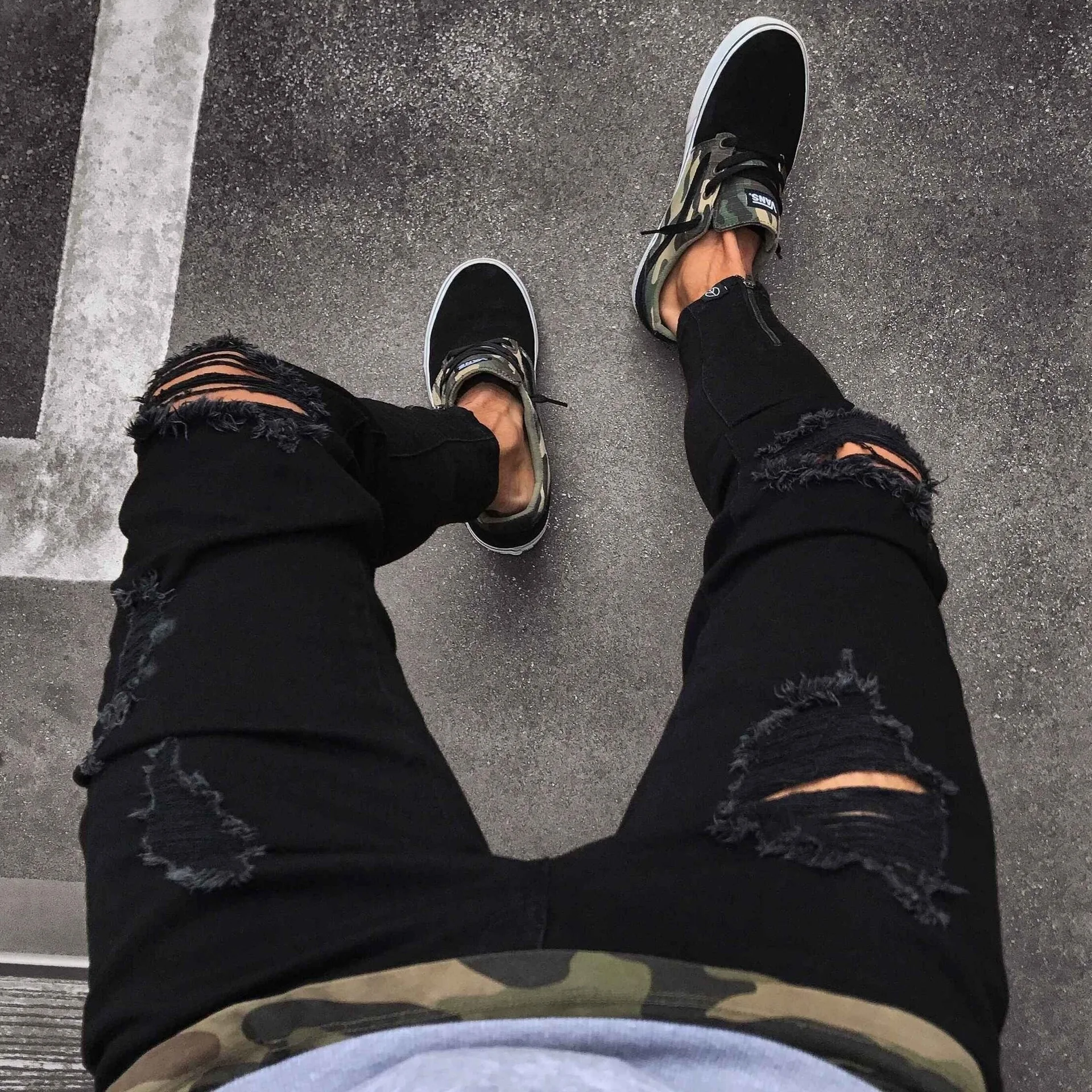 Jeans pour hommes nouveau pantalon tendance noir déchiré avec fermeture éclair extensible pour hommes