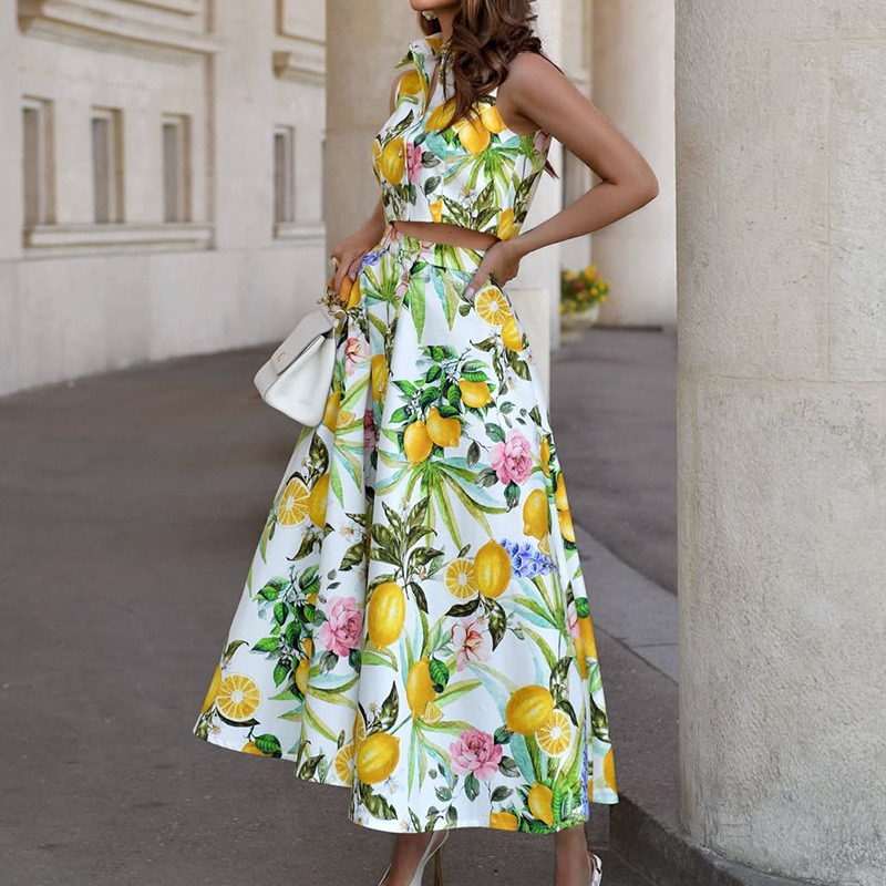 Ensemble deux pièces bohème chic pour femme : haut sans manches à col revers et jupe longue imprimée, idéal pour les fêtes et les vacances d'été