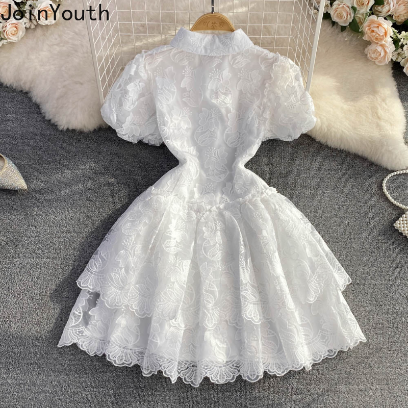 Robe d'été en dentelle blanche pour femmes, tunique de tempérament, manches bouffantes, broderie, à la mode, 2025