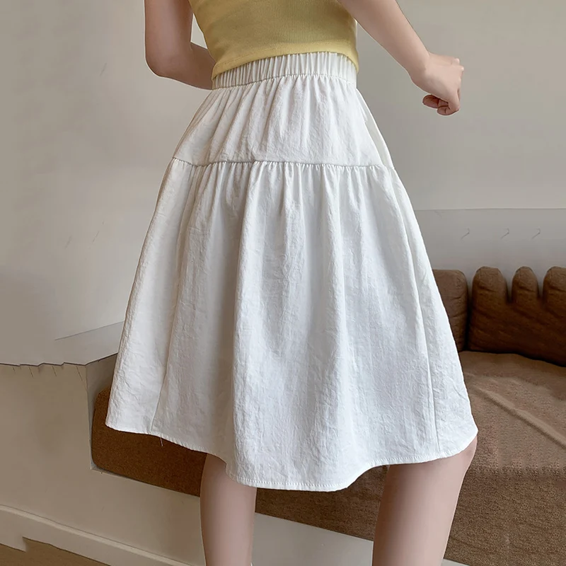 Style collégial ample une ligne jupes femmes été élastique taille haute jupes plissées femme japonais solide au-dessus du genou longueur jupe