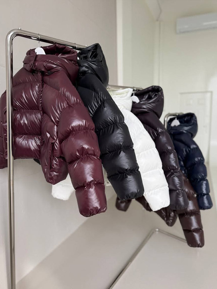 Mode vers le bas femmes coton manteau hiver nouvelle mode chaud à capuche couleur unie épaissin 2025 élégance vers le bas coton rembourré veste