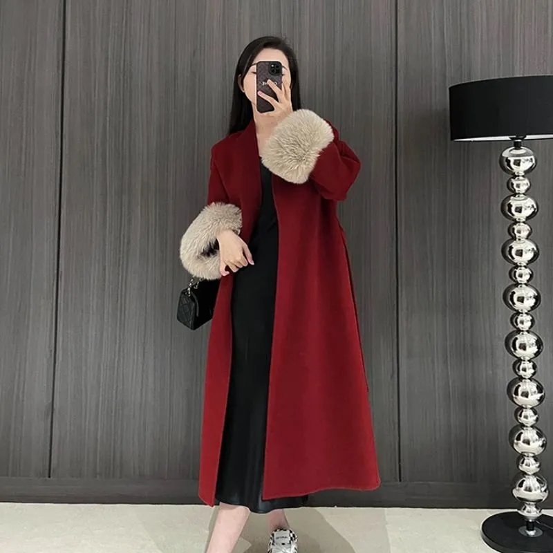 Femmes automne hiver manteau de laine 2025 nouveau haut de gamme Style français manches de fourrure mi-long manteau de laine femmes manteau Long vêtements d'extérieur amples
