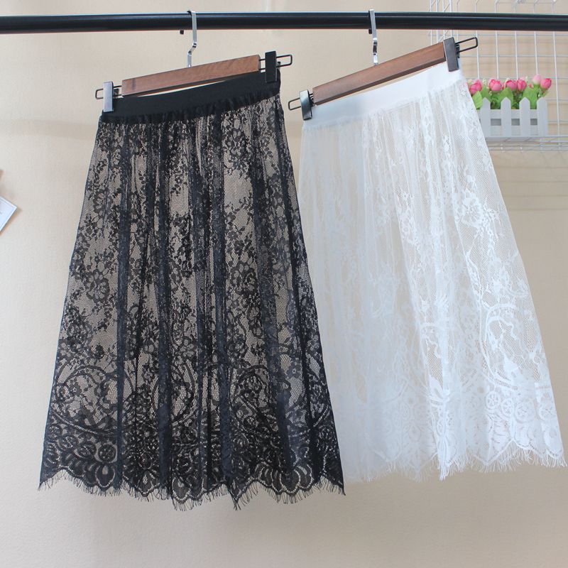 Été chaud femmes dentelle jupes mode solide décontracté maille Tulle jupe évider court crayon élégant élastique noir blanc jupe