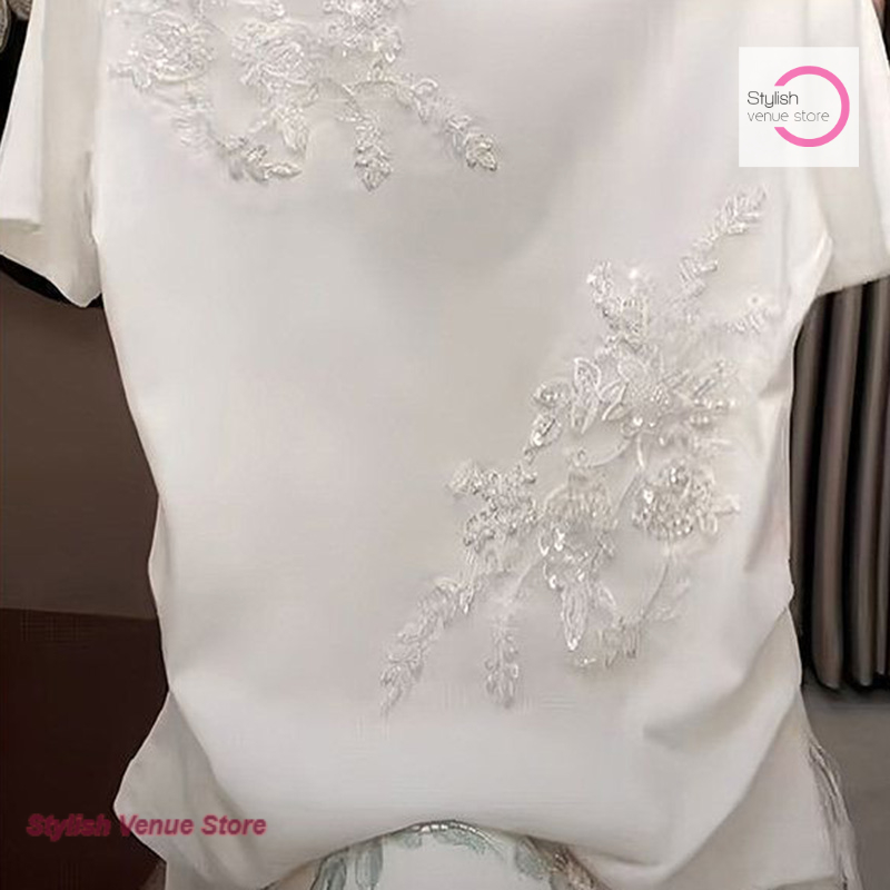 T-shirt blanc brodé de fleurs de style coréen pour femme, nouvelle collection printemps-été, design tendance et décontracté, top polyvalent.