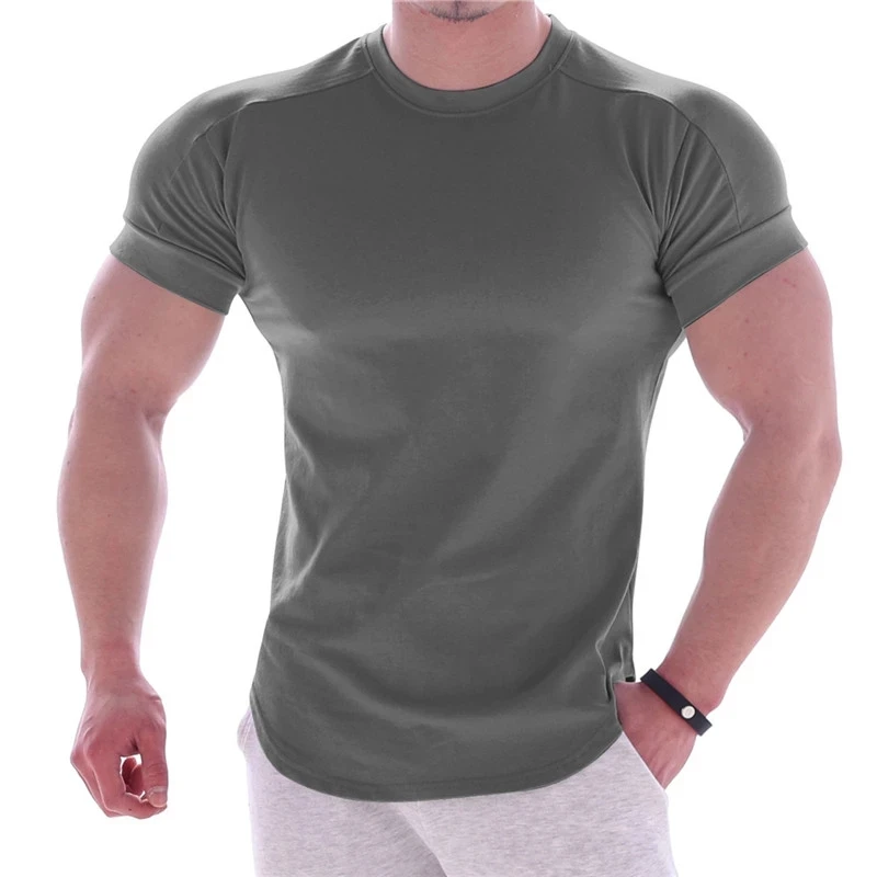 NOUVEAU T-shirt d'été pour hommes, coupe ajustée et très élastique, T-shirt pour hommes à séchage rapide, ourlet incurvé, T-shirts pour hommes, hauts de sport décontractés, couleur unie.