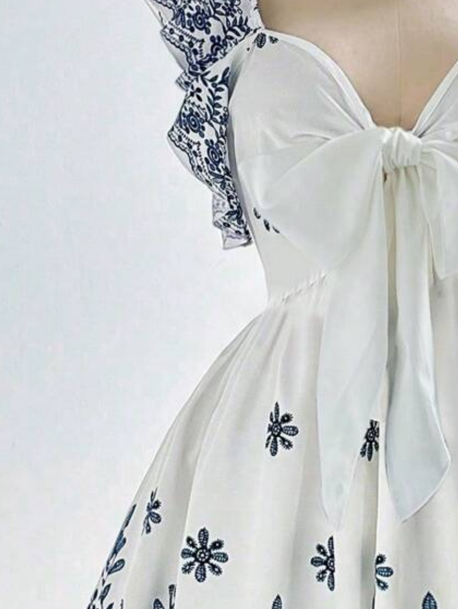 Robe élégante grande taille, imprimé ethnique tendance, design drapé raffiné et sophistiqué