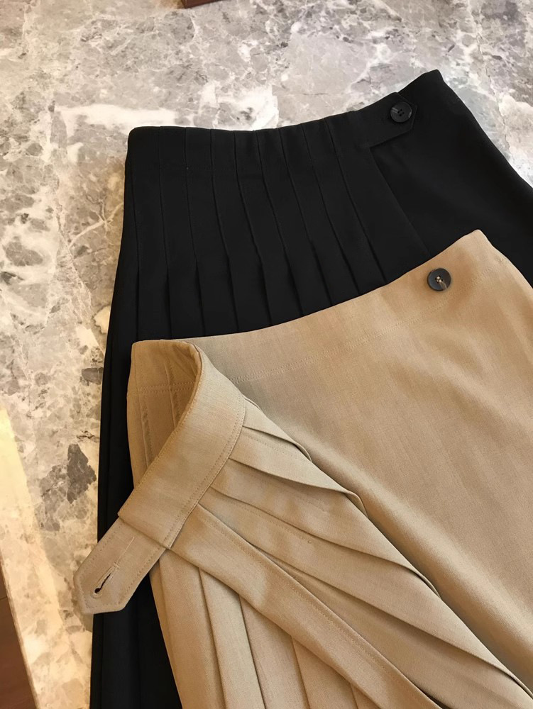 Jupe mi-longue plissée à taille haute de couleur unie décontractée pour femmes printemps-automne