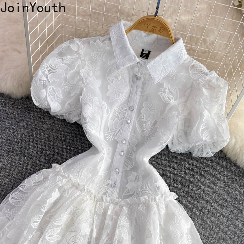 Robe d'été en dentelle blanche pour femmes, tunique de tempérament, manches bouffantes, broderie, à la mode, 2025