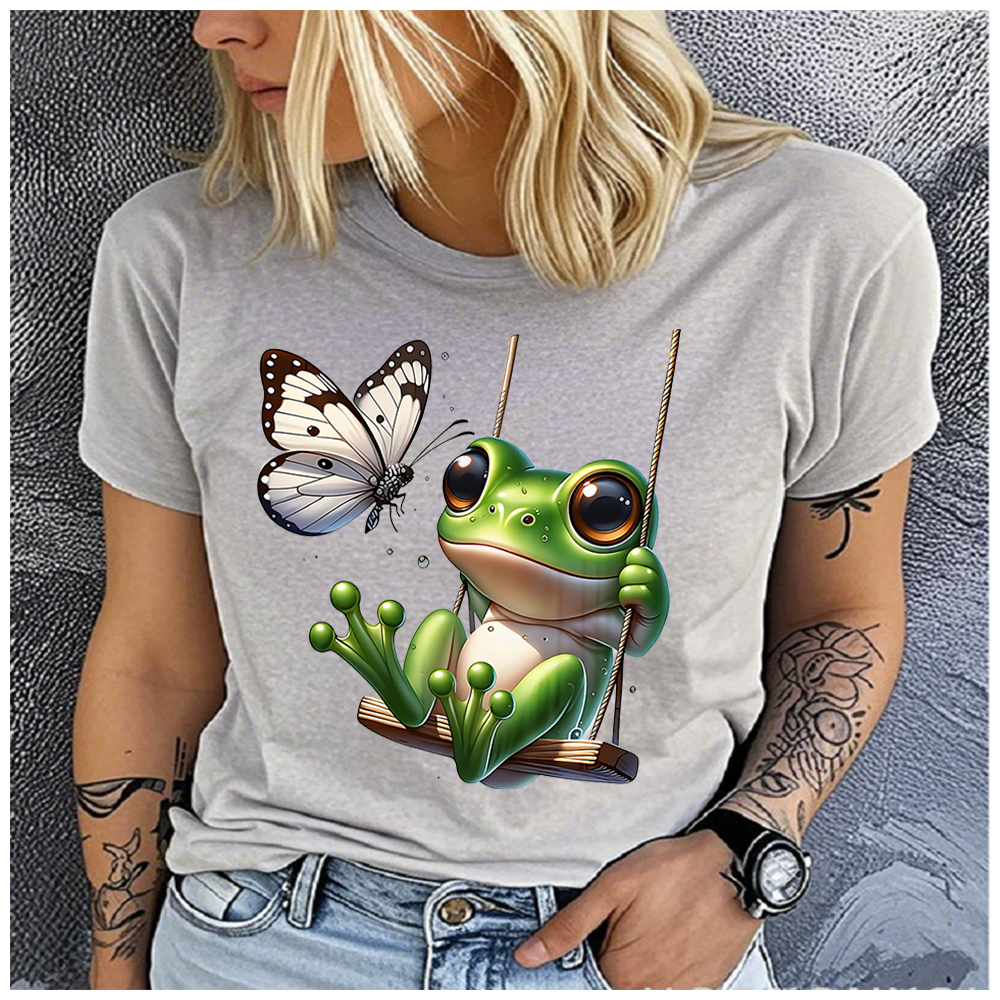 T-shirt en coton 100% pour hommes et femmes, imprimé grenouille sur le balançoire, col rond ample, décontracté, manches courtes, haut à la mode, vêtements d'été