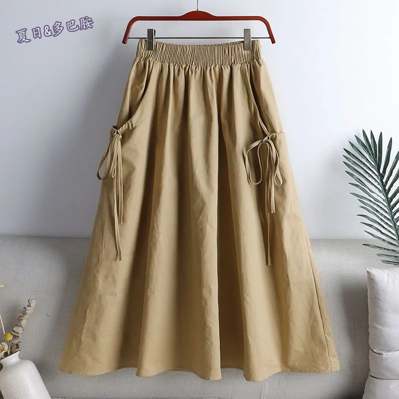 Jupe cargo d'été pour femmes, couleur unie, jupe mi-longue de style coréen avec poches, jupe de travail en forme de A pour étudiantes, jupe cargo pour femmes.