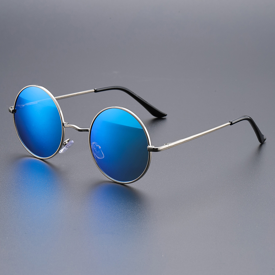 Lunettes de soleil rétro à monture ronde pour la mode ; idéales pour les fêtes, les festivals de musique et la photographie de rue pour un look jeune.